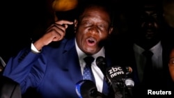 Zimbabwe's former Vice President Emmerson Mnangagwa, who is to be sworn in to replace Robert Mugabe as president, addresses supporters in Harare, Zimbabwe, Nov. 22, 2017. 