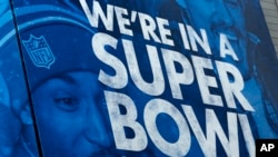 FILE - A billboard is displayed along Super Bowl Boulevard in Times Square in New York, Jan. 31, 2014.