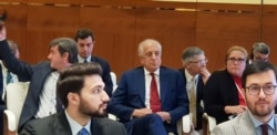 FILE - U.S. Special Representative for Afghanistan Reconciliation Zalmay Khalilzad, center, with red tie, attends the opening of the intra-Afghan dialogue before leaving Afghans to talk among themselves, in Doha, Qatar, July 7, 2019. (A. Tanzeem/VOA)