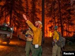 Firefighters prepare to battle the Wolverine wildfire near Chelan, Washington, in this U.S. Forest Service picture taken Aug. 16, 2015.