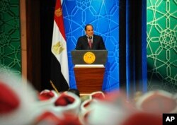 FILE - Egyptian President Abdel-Fattah el-Sissi speaks to Azhar clerics and top government officials in Cairo, Egypt, Dec. 8, 2016.