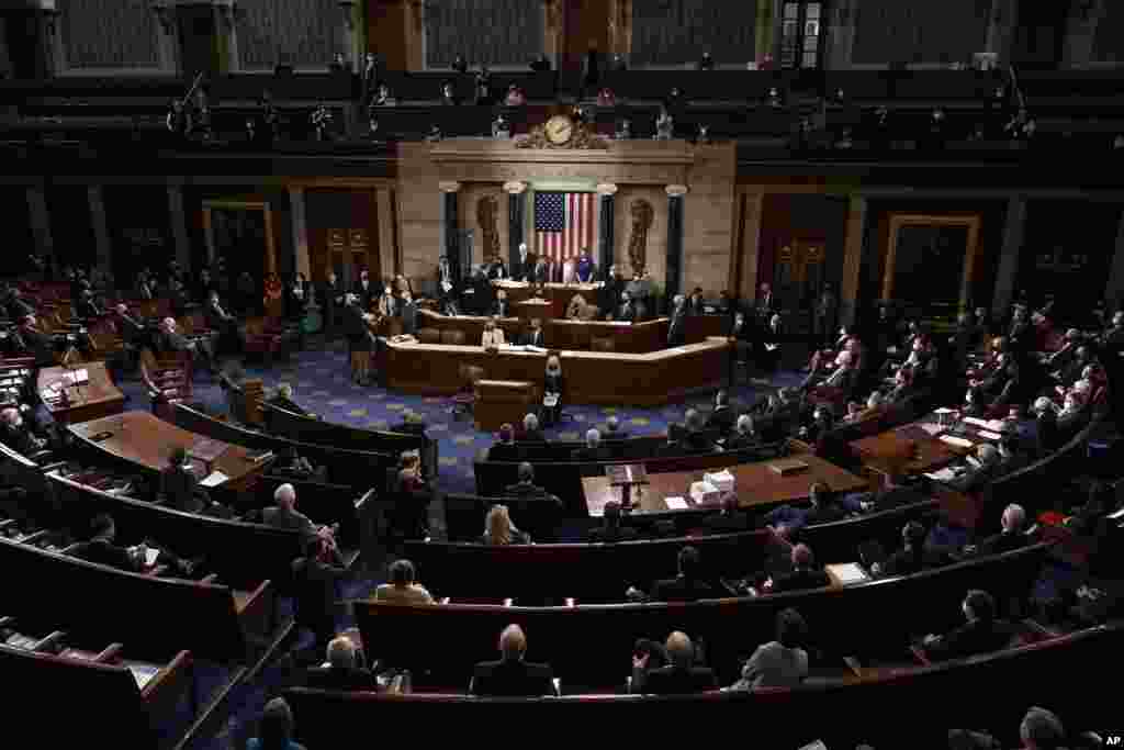 Speaker of the House Nancy Pelosi, D-Calif., and Vice President Mike Pence officiate as a joint session of the House and Senate convenes to confirm the Electoral College votes cast in November's election, at the Capitol in Washington.