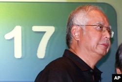 FILE - Malaysian Prime Minister Najib Razak, walks away after a media conference, Kuala Lumpur International Airport, July 18, 2014.