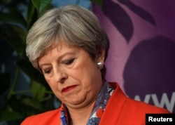 Britain's Prime Minister Theresa May waits for the result of the vote in her constituency at the count center for the general election in Maidenhead, June 9, 2017.