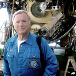 Donald Walsh in front of the Russian Mir Submersible after diving to the World War II German battleship Bismarck.