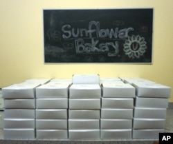 Sunflower Bakery's desserts are boxed and ready to be delivered.