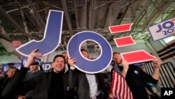 Supporters cheer at a primary election night rally for Democratic presidential candidate former Vice President Joe Biden in Columbia, S.C., Feb. 29, 2020.