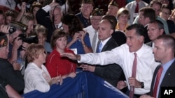 Republican presidential candidate, former Massachusetts Gov. Mitt Romney waves to members of the Veterans of Foreign Wars after his speech at the VFW national convention in Reno, Nev. Tuesday July 24, 2012.