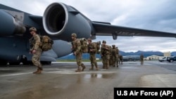 FILE - U.S. Army Soldiers board a U.S. Air Force C-17 Globemaster III as part of a force projection exercise at Joint Base Elmendorf-Richardson, Alaska, Sept. 13, 2024. 