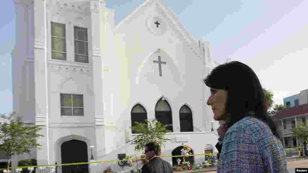 South Carolina Governor Nikki Haley walks between television interviews outside the Emanuel African Methodist Episcopal Church in Charleston, South Carolina, June 19, 2015.