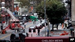 FILE - Emergency personnel work at the scene of Saturday's explosion on West 23rd Street in Manhattan's Chelsea neighborhood in New York, Sept. 19, 2016.