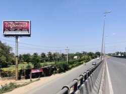 Glitzy roadside advertisements have given way to coronavirus messages. (Anjana Pasricha/VOA)