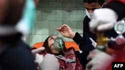 A Syrian woman receives treatment at a hospital in the regime controlled Aleppo on Nov. 24, 2018. Official Syrian media accused the armed opposition of launching an attack with "toxic gas" on the northern city.