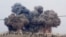 FILE - In this image made from video provided by Hadi Al-Abdallah, which has been verified and is consistent with other AP reporting, smoke rises after airstrikes in Kafr Nabel of the Idlib province, western Syria, Oct. 1, 2015. 