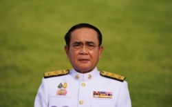FILE - Thailand's Prime Minister Prayuth Chan-ocha attends a family photo session at the Government House in Bangkok, Thailand, March 30, 2021.