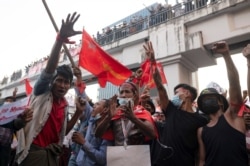 People join a rally against the military coup and to demand the release of elected leader Aung San Suu Kyi, in Yangon, Myanmar, Feb. 8, 2021.