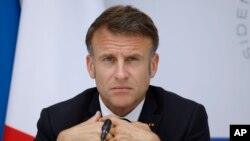 FILE - European Union officials criticized France's public debt on June 19, 2024, as French President Emmanuel Macron, shown here at the Elysee Palace in Paris on May 21, 2024, is in a tight parliamentary election race with the far right and left.