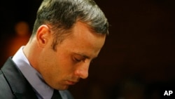 Olympic athlete Oscar Pistorius stands during his bail hearing at the magistrate court in Pretoria, South Africa, February 21, 2013