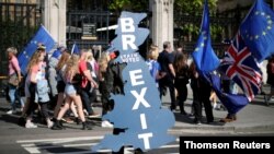 FILE: A pro-Brexit supporter is seen outside the Parliament in London.