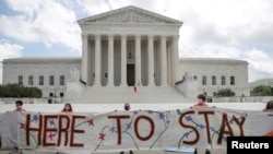 FILE - DACA recipients and their supporters celebrate outside the U.S. Supreme Court after the court ruled in a 5-4 vote that U.S. President Donald Trump's 2017 move to rescind DACA, was unlawful, Washington, June 18, 2020. This week, DACA marks its 10th year.