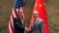 Wang Yi, right, the director of the Communist Party's Central Foreign Affairs Commission Office shakes hands with White House national security adviser Jake Sullivan, left, at Yanqi lake in Beijing, Aug. 27, 2024.
