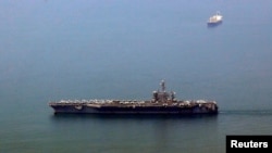 The US aircraft carrier USS Carl Vinson arrives at a port in Danang, Vietnam March 5, 2018.