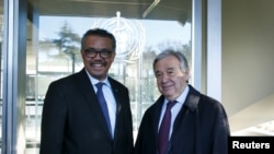 FILE - Director General of the World Health Organization (WHO) Tedros Adhanom Ghebreyesus, left, welcomes U.N. Secretary General Antonio Guterres at WHO headquarters in Geneva, Switzerland, Feb. 24, 2020. 