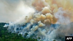 (FILES) In this photo of August 16, 2020, aerial view of a burning area of Amazon rainforest reserve causing a sharp rise in respiratory emergencies in a region already hit hard by Covid-19, said a study published recently.