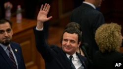 Albin Kurti, the newly elected prime minister of Kosovo, waves after a new government was elected, in the capital Pristina, Feb. 3, 2020.