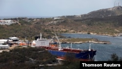 FILE - A crude oil tanker is docked at Isla Oil Refinery PDVSA terminal in Willemstad on the island of Curacao, Feb. 22, 2019. 