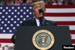 U.S. President Donald Trump addresses supporters during a "Make America Great Again" rally in Southaven, Mississippi, Oct. 2, 2018.