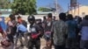 Fantom 509 renegade officers and their supporters exit Croix des Bouquets police station after freeing a colleague from jail, March 18, 2021. (Matiado Vilme/VOA)