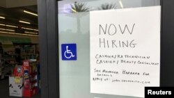 A handwritten hiring sign is posted outside a local drugstore in Solana Beach, California, U.S., July 17, 2017.