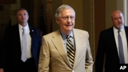 Senate Majority Leader Mitch McConnell of Kentucky walks from his office on Capitol Hill in Washington, June 26, 2017. Senate Republicans unveiled a revised health care bill this week in hopes of securing support from wavering GOP lawmakers, but McConnell said Tuesday that he would delay a planned vote on the measure.