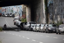 Vehicles line up near a gas station to fill their tanks in Caracas, Venezuela, Sept. 8, 2020.