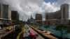 FILE - Traffic flows past gaming resorts at Cotai Strip in Macau, May 15, 2018. 
