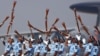 Indian Air Force soldiers toss their rifles during the full-dress rehearsal for Indian Air Force Day at the Hindon air force station on the outskirts of New Delhi.