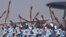 Indian Air Force soldiers toss their rifles during the full-dress rehearsal for Indian Air Force Day at the Hindon air force station on the outskirts of New Delhi.
