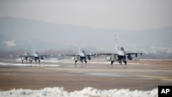 FILE - U.S. Air Force F-16 fighter jets take part in a joint aerial drills between U.S and South Korea, at the Osan Air Base in Pyeongtaek, South Korea. A bipartisan group of U.S. lawmakers is pressing President Joe Biden to send F-16 planes to Ukraine. 