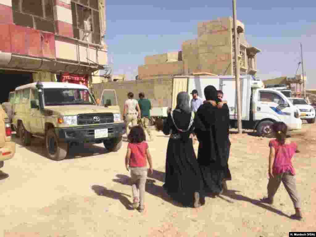 Umm Saja and her family arrive at a field hospital in Mosul, Iraq, June 21, 2017, after fleeing their home in IS-territory only an hour before. Her daughter, 1-year-old Saja, is so thin from lack of food that doctors have difficulty finding veins to injec