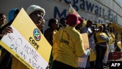 Members of South African political party Congress of the People (COPE) demonstrate outside state entity Eskom Offices at Megawatt Park against the re-instatement of Brian Molefe as Eskom CEO on May 15, 2017. 