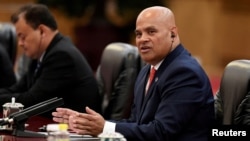 FILE - Micronesia's President David Panuelo talks with China's President Xi Jinping (not pictured) at the Great Hall of the People in Beijing, China, Dec. 13, 2019. Panuelo is alleging that Chinese agents followed him during a recent trip to Fiji.