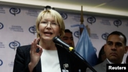 FILE - Venezuela's chief prosecutor Luisa Ortega Diaz talks to the media during a news conference in Caracas, Venezuela May 24, 2017.