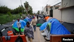 Migrants who are seeking asylum into the United States set up a makeshift encampment, in Matamoros