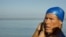 Swimmer Diana Nyad adjusts her swimming cap before her swim to Florida from Havana, Cuba, Aug. 31, 2013. 
