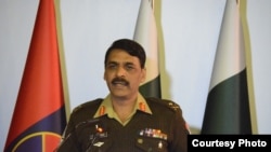 FILE - Pakistani Army spokesman Major-General Asif Ghafoor holds a press briefing.