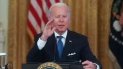 U.S. President Joe Biden responds to questions from reporters as he meets with his Competition Council in the East Room of the White House in Washington, Jan. 24, 2022.