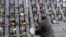 A man takes part in a commemoration ceremony, Nov. 21, 2019, at a monument to the "Heavenly Hundred," the anti-government protesters killed during the Ukrainian pro-European Union mass demonstrations in 2014, to mark the sixth anniversary of the uprising.