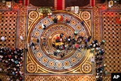 In this photo taken May 23, 2017, Russian Orthodox believers line up to kiss the relics of Saint Nicholas that were brought from an Italian church where they have lain for 930 years, in the Christ the Savior Cathedral in Moscow, Russia.