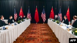 US Secretary of State Antony Blinken (2nd R), joined by National Security Advisor Jake Sullivan (R), speaks while facing Yang Jiechi (2nd L), director of the Central Foreign Affairs Commission Office, and Wang Yi (L), China's Foreign Minister at the opening of the meeting. (AFP)